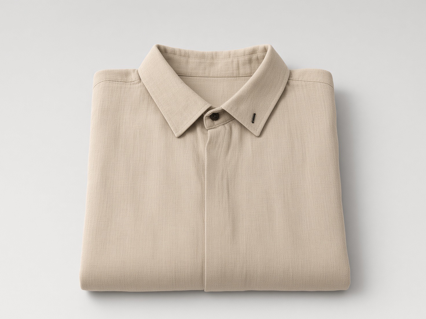 Studio packshot: the linen shirt, folded